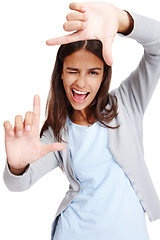 Image showing Business woman, framing face and portrait of a person holding hands with a smile. White background, isolated and vertical frame of a female employee in a studio with mock up making a image hand sign