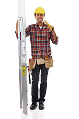 Image showing Construction, maintenance and portrait of a builder on a ladder for home improvement. Service, happy and safety construction worker with a building or repair job on a white background in studio