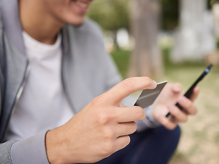 Image showing Credit card, online shopping and outdoor man, phone payment, fintech and ecommerce in park. Hands, smartphone and money transfer from mobile app, internet banking and cash finance, connection and web