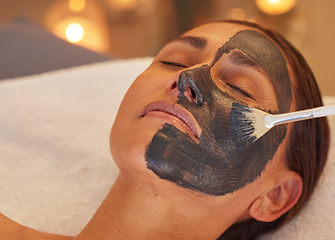 Image showing Spa, woman and charcoal face mask, skincare and luxury for health, wellness and clear skin. Beauty, cosmetics and girl with organic facial, detox and natural care for confidence or treatment to relax