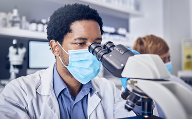 Image showing Science, covid and black man in laboratory with microscope and face mask, motivation in future vaccine development. Healthcare, scientist or pharmacist with ideas and innovation in medical research.