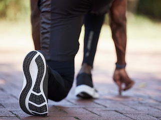 Image showing Sneakers, runner and fitness with black man start to run outdoor, healthy lifestyle and wellness with athlete and sport. Runner, workout shoes and body training with sports motivation and cardio