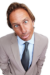 Image showing Funny, comic and portrait of a business man with a silly face and a suit with white background. Crazy, joke and comedy of a model executive isolated with funny face and humor being goofy for work