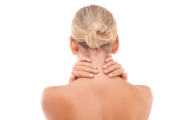 Image showing Neck pain, injury and woman in a studio with discomfort, stress or ache after a spa body care treatment. Self care, sore and back view of a female model with a muscle sprain by a white background.