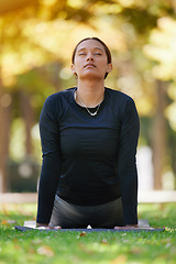 Image showing Yoga, cobra stretching and woman at park for health, wellness and flexibility. Zen chakra, pilates pose and female with eyes closed training, meditation and exercise, workout and mindfulness outdoors