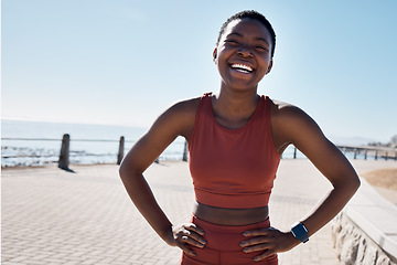 Image showing Fitness, black woman and portrait of a runner by the sea with happiness and smile training. Relax, happy and workout of a athlete doing sport, marathon and exercise ready for cardio running