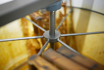 Image showing Honey production, harvest machine and manufacturing for agriculture, apiculture and sustainable industry. Factory, warehouse and food for health, organic nutrition and natural honeycomb in workshop