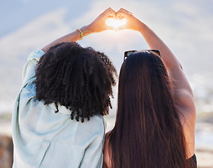 Image showing Women back, heart and hands together for beach travel holiday, summer vacation and relax quality time friendship. Friends, love sign emoji and happiness lifestyle for ocean sunshine or adventure