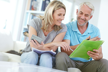 Image showing Senior couple, home budget and finance with a calculator and bills for investment, savings or debt. Man and woman in happy marriage with paperwork for retirement, mortgage or to invest pension