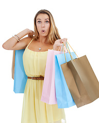 Image showing Portrait, shocked and woman with bags, shopping and luxury boutique items with client isolated on white studio background. Female, shopper and customer surprised, expensive items or sale for discount