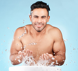 Image showing Cleaning, water splash and portrait of man happy with self care routine, facial hygiene and body hygiene wash. Water drop, bathroom skincare hydration and beauty model with health wellness treatment