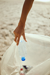 Image showing Cleaning, plastic and hands of volunteer at beach for recycle, environment or earth day. Recycling, sustainability and climate change with charity person and trash bag for pollution and eco friendly