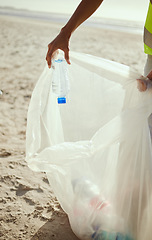 Image showing Cleaning, plastic and hands of volunteer at beach for recycle, environment or earth day. Recycling, sustainability and climate change with charity activist and trash bag for pollution or eco friendly