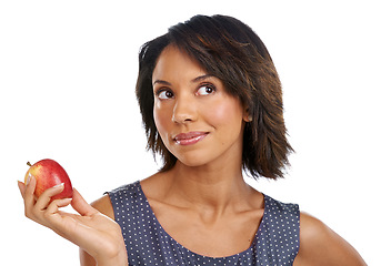 Image showing Fruit, thinking or black woman eating an apple in studio on white background with marketing mockup space. Choices, ideas or thoughtful African girl advertising a healthy natural diet for wellness