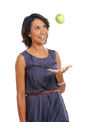 Image showing Throw, health or black woman eating an apple or fruits in studio on white background with marketing space. Smile, organic or happy African girl advertising healthy food diet for self care or wellness