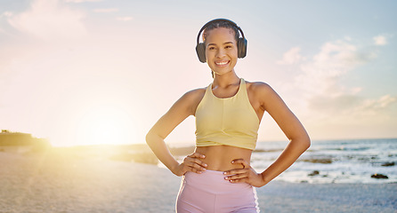 Image showing Fitness, exercise and portrait of woman at the beach in morning for healthy lifestyle, wellness and cardio. Sports, nature and happy woman ready for training, running and workout with headphones