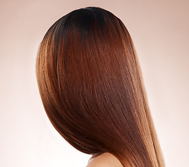 Image showing Salon, hair and back of woman in studio for hair care, hair products and cosmetics on beige background. Beauty, balayage and girl with healthy, shine and long hair for hair salon, treatment and glow