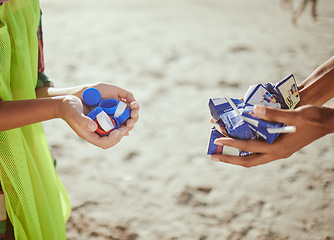 Image showing Cleaning, plastic and hands of volunteer at beach for recycle, environment or earth day. Recycling, sustainability and climate change with charity team and trash for pollution, eco friendly and help