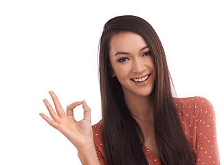 Image showing Success, ok and portrait of Asian woman on a white background to vote, agreement and approval. Mockup, advertising and face of girl isolated in studio with hand gesture for good news, support and yes