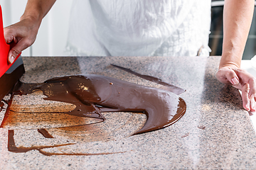 Image showing Tempering melted chocolate