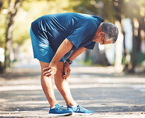 Image showing Exercise, senior man and tired outdoor, breathing and balance for wellness, health and retirement. Elderly male, athlete and resting for workout, runner and exhausted for fitness, training and cardio
