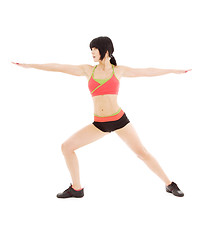 Image showing woman practicing virabhadrasana warrior pose