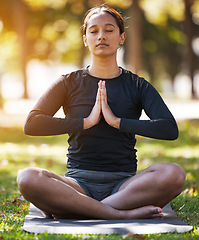 Image showing Relax woman, namaste and meditation at park, wellness or freedom of chakra energy, zen fitness or peace. Young girl, yoga exercise and lotus praying in nature with eyes closed, mental health and calm