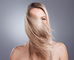 Image showing Woman portrait, blonde or windy hairstyle on studio background for keratin treatment, healthcare wellness or self care grooming. Skincare beauty model, hair care or dye color for argan salon product