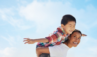 Image showing Mom, piggyback airplane and child by sky with smile, family bonding or outdoor vacation in summer. Happy family, interracial and black woman back for asian adoption, love or game on holiday adventure