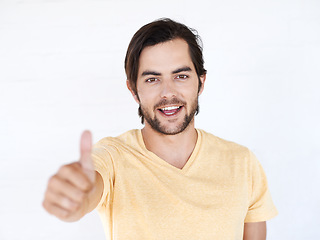 Image showing Thumbs up, portrait and man in studio, white background or isolated review. Happy male model, thumb up and support of yes agreement, celebration and like emoji for vote of trust, thank you or success