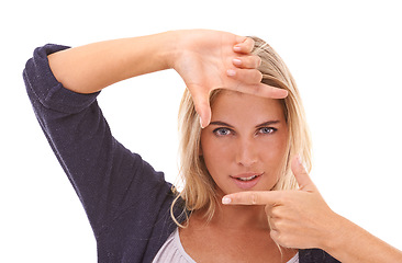 Image showing Portrait, hands and finger frame with a woman in studio on a white background framing her face. Beauty, fingers and photography with an attractive young female posing for skincare or wellness