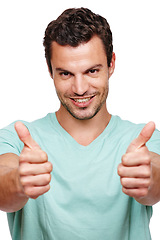 Image showing Thumbs up, approval and portrait of a happy man in a studio with success, good news and agreement. Happiness, smile and male model with a yes, ok and satisfaction gesture isolated by white background