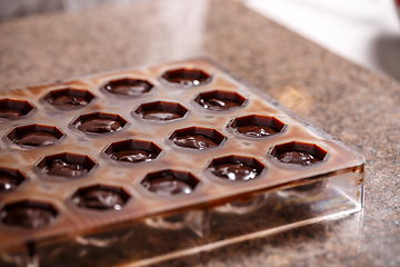 Image showing Mold with chocolate