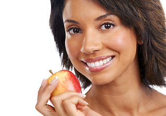 Image showing Portrait, fruit or happy black woman eating an apple in studio on white background with marketing mockup space. Smile, face or African girl advertising healthy food or diet for nutrition for wellness