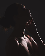 Image showing Woman beauty silhouette, face and dark, sexy with cosmetics and seductive fantasy with mysterious aesthetic. Female profile with skin, sexy woman facial and shadow against black studio background.