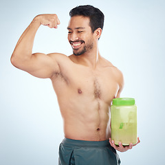 Image showing Fitness, man and protein powder for muscle gain, diet and weight loss on grey studio background. Male, athlete and body builder for sports nutrition container, supplement and healthy energy drink.