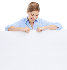 Image showing News, woman behind blank sign and mockup with product placement isolated on white background. Advertising, marketing and portrait of happy woman looking down at poster board announcement and smile.