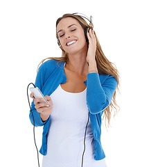 Image showing Woman, studio and music headphones with smartphone, smile and relax by white background for happiness. Model, phone and streaming audio on internet app, website or radio while isolated for peace