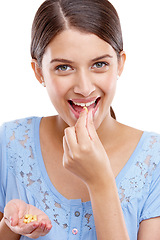 Image showing Portrait, pills and medicine with a model woman in studio isolated on a white background for vitamins or supplements. Medical, health and tablet with a young female on blank space for medication