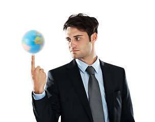 Image showing Globe, businessman and earth on finger, sustainability in international industry isolated on white background. Balance, global focus and man with planet in hand, worldwide corporate success in studio