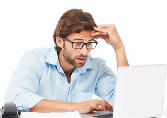 Image showing Shock, surprise and businessman on a laptop working on a project with a deadline in a studio. Shocked, wow and professional male employee gasping while doing research on computer by white background.