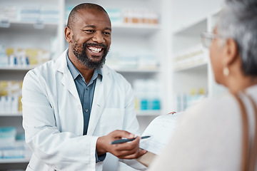 Image showing Pharmacy, medicine and pharmacist in discussion with a patient explaining her prescription. Healthcare, medical and African male chemist speaking to a woman at a pharmaceutical clinic or drug store.
