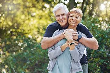 Image showing Nature, love and man hugging his wife with care, happiness and affection while on an outdoor walk. Happy, romance and portrait of a senior couple in retirement embracing in the forest, woods or park.