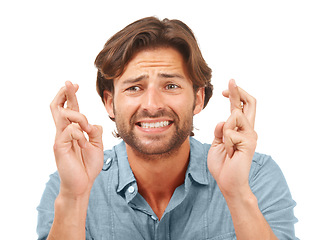 Image showing Man hands, face or fingers crossed in anxiety, hope or Canada nervous expression on white background studio. Zoom, model or worried person in wish, good luck or change gesture for new job opportunity