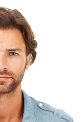 Image showing Half face, portrait and man in a studio with mockup space for marketing or advertisement. Natural, young and handsome male model isolated by a white background with mock up for product placement.