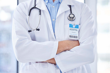 Image showing Closeup, man and doctor with arms crossed, healthcare and leadership in hospital. Male, surgeon and medical professional with confidence, leader and ready for surgery procedure, medicine and wellness