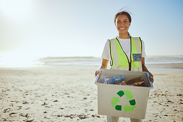 Image showing Recycle, plastic and woman cleaning beach for sustainability, green environment and eco friendly world with happy volunteering portrait. Box, bottle and black woman at sea for pollution or earth day