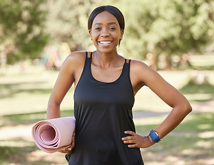 Image showing Portrait of black woman in park with yoga mat and smile in nature for health and fitness mindset and care. Exercise, zen and yoga, happy face on woman ready for pilates workout on grass in summer sun