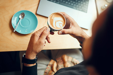 Image showing Coffee cup, man hands and laptop with remote work, planning and wifi internet in retail, business or restaurant marketing background. Coffee shop, cafe and creative table top with hand holding drink