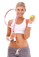 Image showing Tennis girl, studio portrait and racket with tennis ball for health, sports and wellness by white background. Happy tennis player woman, focus and mindset while isolated for training, fitness or goal